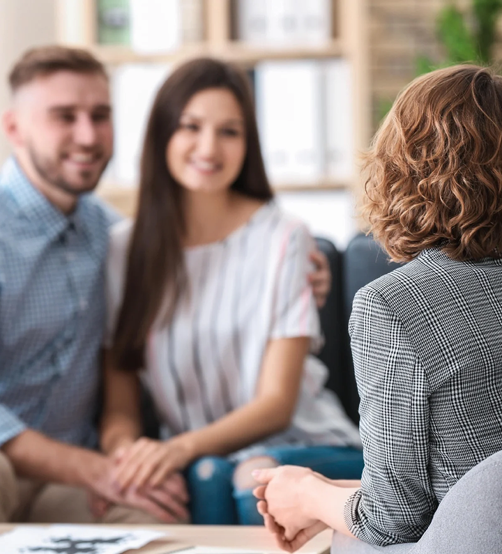 Couple attending coaching session with professional therapist